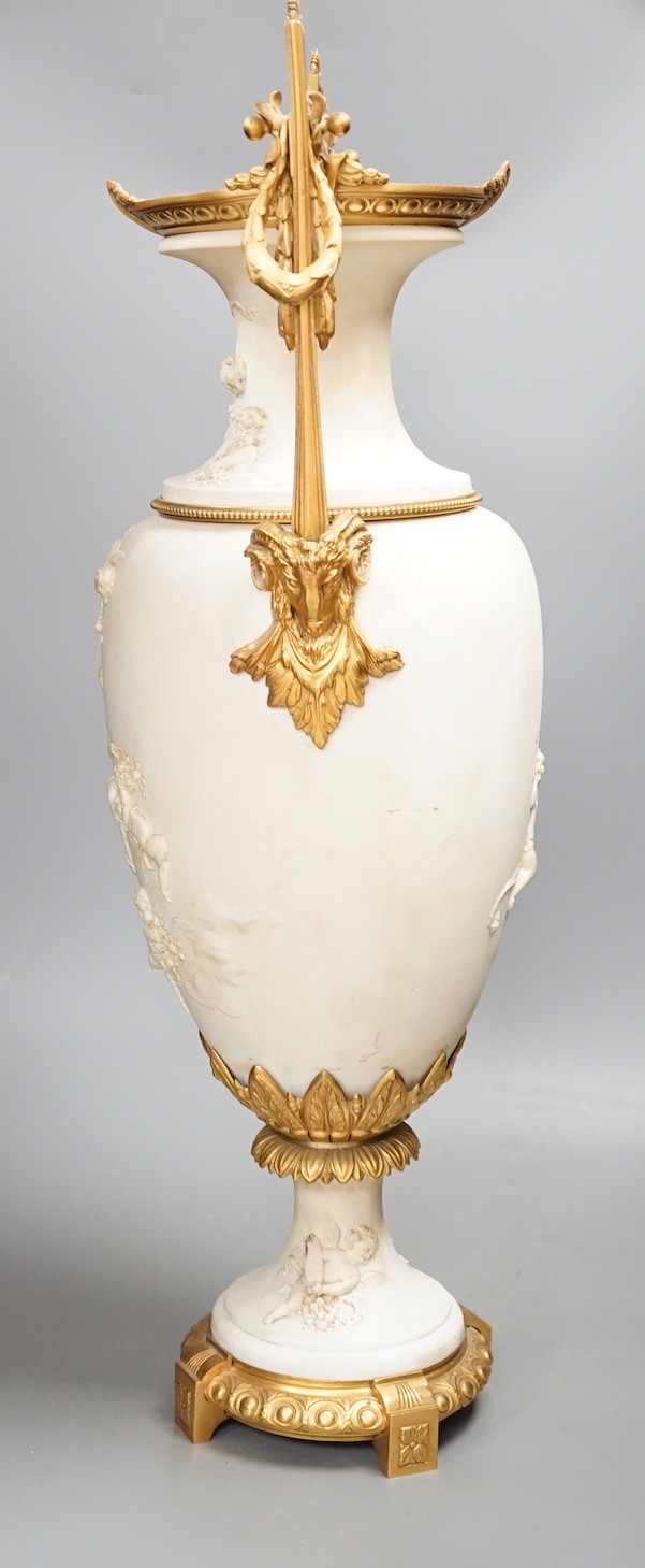 A large Louis XVI style ormolu mounted biscuit porcelain urn - 63cm tall